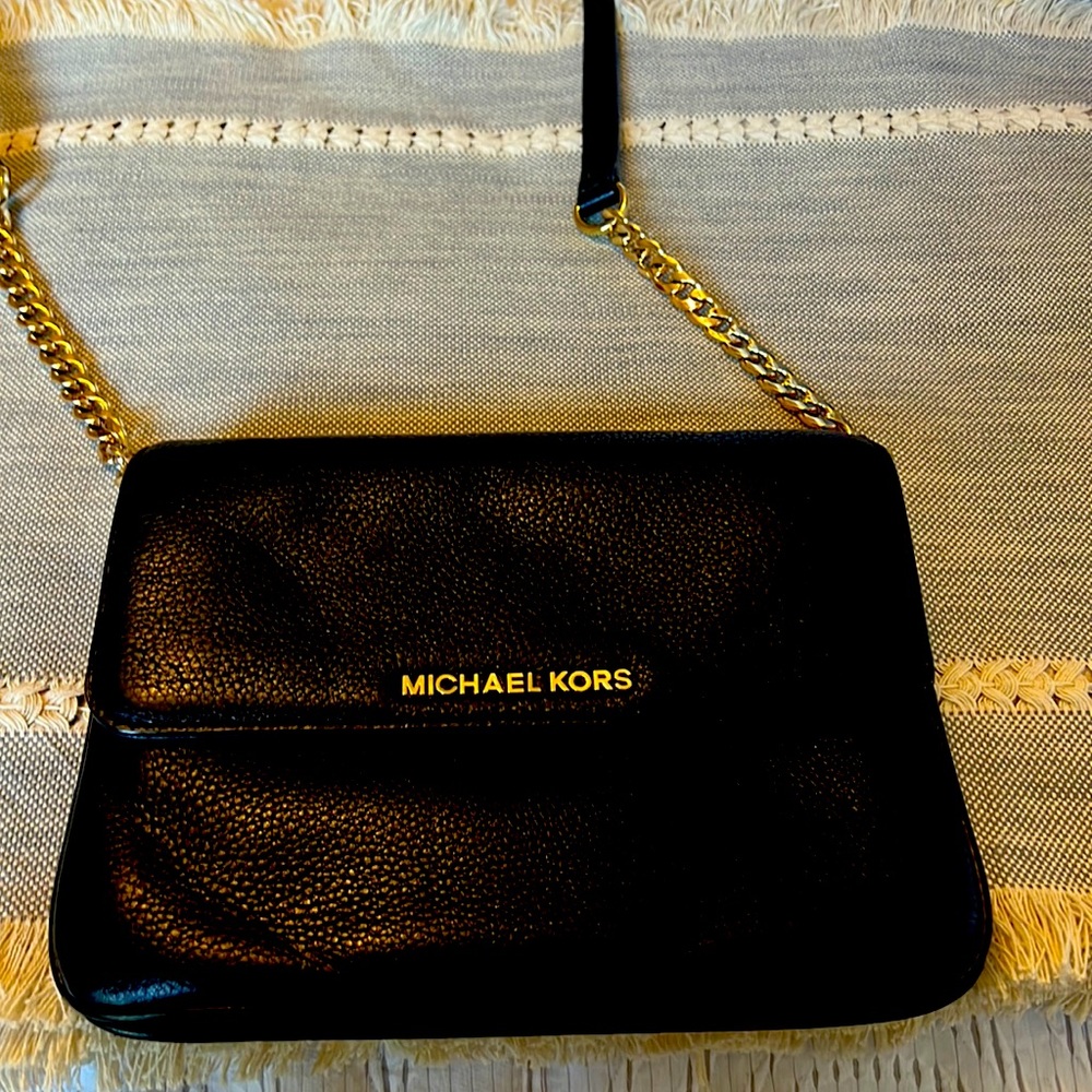 Black leather Michael Kors Crossbody with two pouches- one zippers pouch.